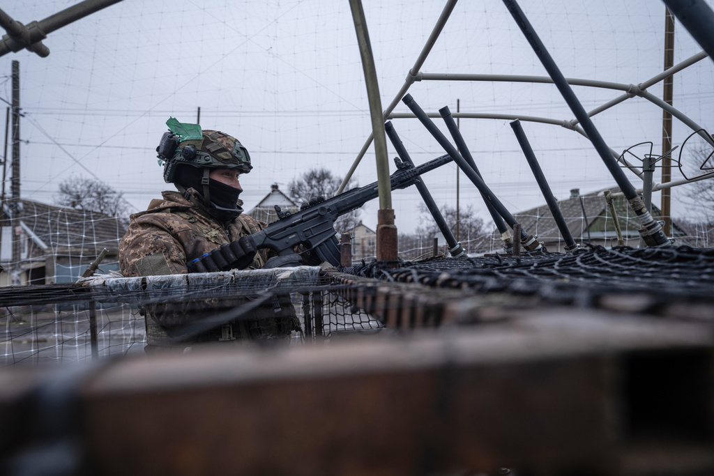 In this photo provided by Ukraine's 93rd Kholodnyi Yar Separate Mechanized Brigade press service, a soldier in a vehicle gets ready to shoot down Russian FPV drones in Donetsk region, Ukraine, Saturday, Jan. 31, 2026. (Iryna Rybakova/Ukraine's 93rd Mechanized Brigade via AP)