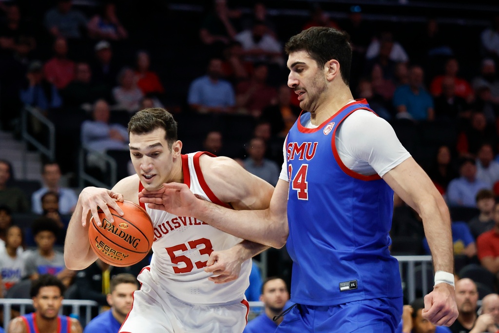 Louisville forward Vangelis Zougris (53) drives against SMU center Samet Yigitoglu during the first half of an NCAA college basketball game in the second round of the Atlantic Coast Conference tournament in Charlotte, N.C., Wednesday, March 11, 2026. (AP Photo/Nell Redmond)