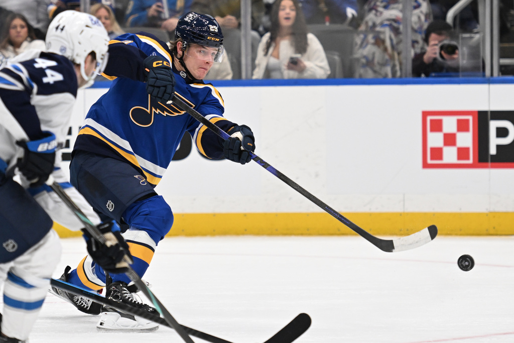 St. Louis Blues right wing Jonatan Berggren (29) takes a shot against the Winnipeg Jets during the second period of an NHL hockey game on Wednesday, Dec. 17, 2025, in St. Louis. (AP Photo/Joe Puetz)