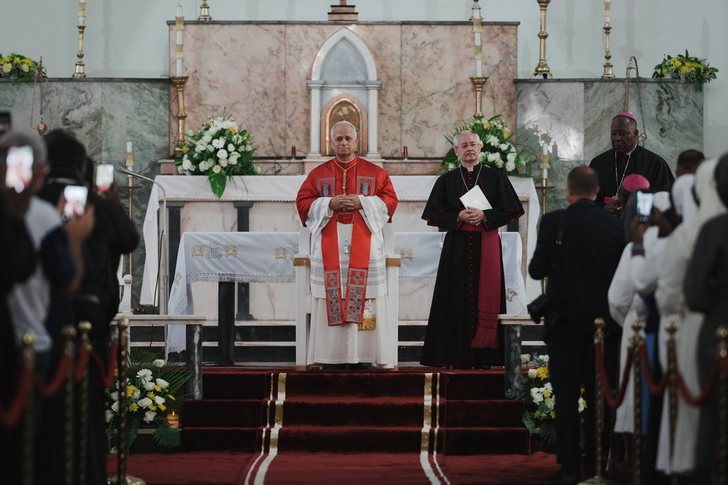 Pope Leo XIV arrives at the Parish of Our Lady of Fatima in Luanda, Angola, for a meeting with bishops, priests, consecrated men and women, and pastoral workers Monday, April 20, 2026, on the eighth day of an 11-day apostolic journey to Africa (AP Photo/Andrew Medichini)