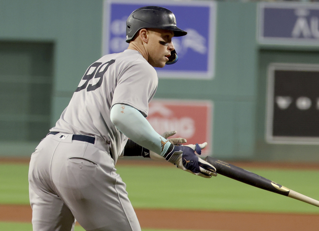 New York Yankees designated hitter Aaron Judge drops the bat after hitting a home run during the first inning of a baseball game against the Boston Red Sox, Friday, Sept. 12, 2025, in Boston. (AP Photo/Mark Stockwell)