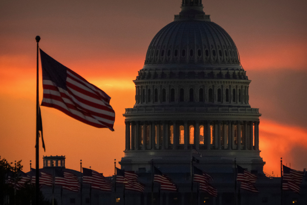 The dome of the U.S. Capitol is seen at sunrise on Wednesday, Oct. 1, 2025, in Washington. (AP Photo/Mark Schiefelbein)
