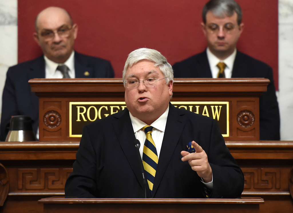 FILE - West Virginia Gov. Patrick Morrisey, center, gives his first State of the State in the House of Delegates chamber at the Capitol in Charleston, W.Va., Feb. 12, 2025. (Chris Dorst/Charleston Gazette-Mail via AP, file)