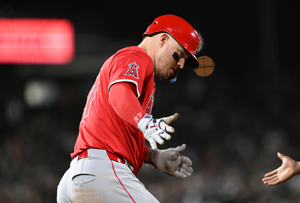 Los Angeles Angels designated hitter Mike Trout celebrates as he rounds the bases after hitting a home run in the eighth inning against the Colorado Rockies on Saturday, Sept. 20, 2025, in Denver. (AP Photo/RJ Sangosti)