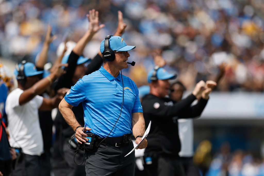 Los Angeles Chargers head coach Jim Harbaugh watches from the sideline during the first half of an NFL football game against the Arizona Cardinals, Sunday, Sept. 13, 2026, in Inglewood, Calif. (AP Photo/Caroline Brehman)