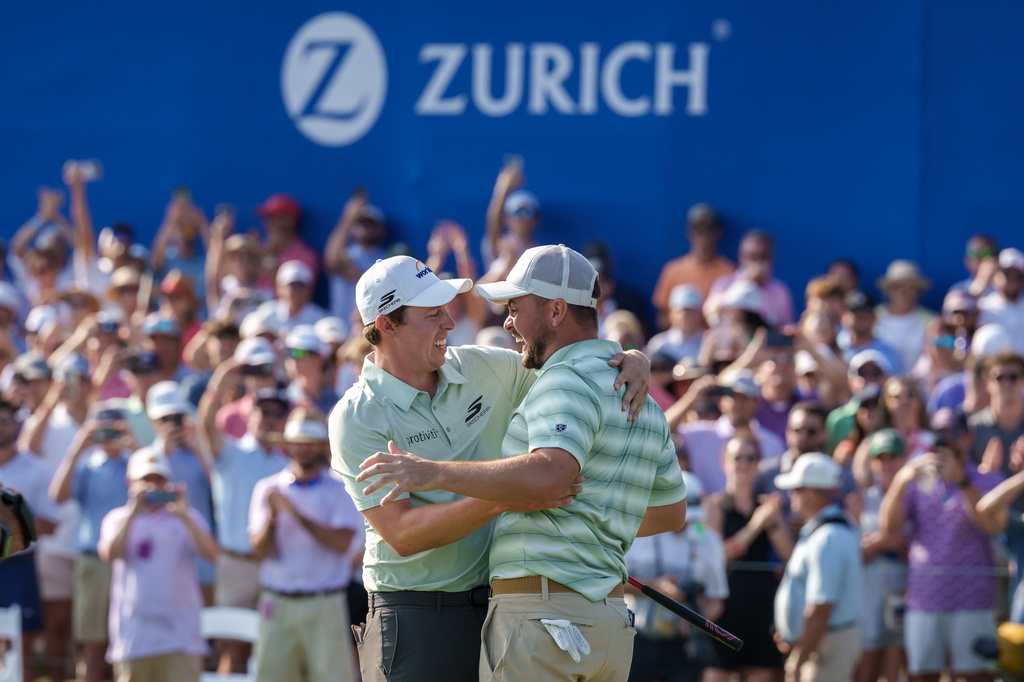 Alex Fitzpatrick, right, of England, reacts after sinking a birdie putt and winning the tournament with his brother Matt Fitzpatrick, left, during the final round of the PGA Zurich Classic of New Orleans golf tournament, Sunday, April 26, 2026, in Avondale, La. (AP Photo/Matthew Hinton)