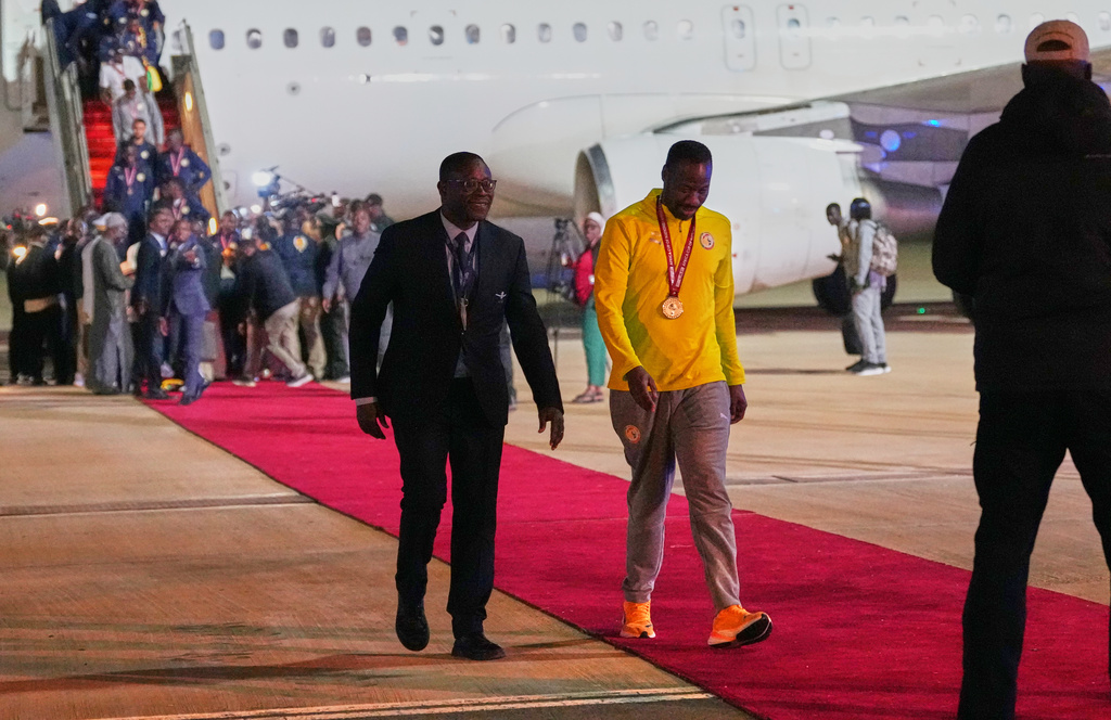 Senegal's head coach Pape Thiaw, center, arrives following their victory in the Africa Cup of Nations soccer tournament, in Ndiass, Senegal, Tuesday, Jan. 20, 2026. (AP Photo/Misper Apawu)