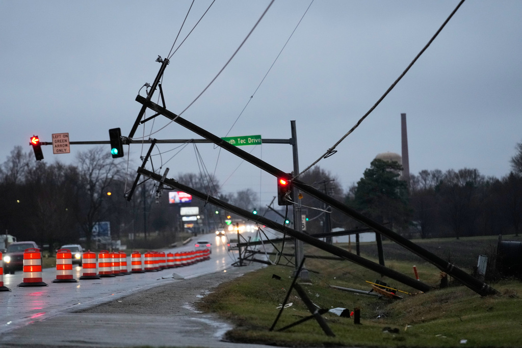 Utility poles are damaged in the aftermath of a powerful storm that ripped through the area a day earlier in Kankakee, Ill., Wednesday, March 11, 2026. (AP Photo/Nam Y. Huh)