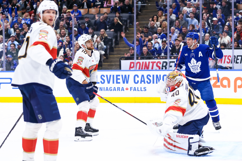 Toronto Maple Leafs' John Tavares (91) celebrates a goal on Florida Panthers goaltender Daniil Tarasov (40) during second period NHL action in Toronto on Saturday, April 11, 2026. (Cole Burston/The Canadian Press via AP)