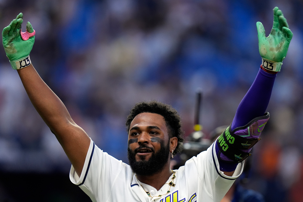 Tampa Bay Rays third baseman Junior Caminero celebrates after his game-winning home run off Houston Astros pitcher Bryan Abreu during the ninth inning of a baseball game Friday, Sept. 11, 2026, in St. Petersburg, Fla. (AP Photo/Chris O'Meara)