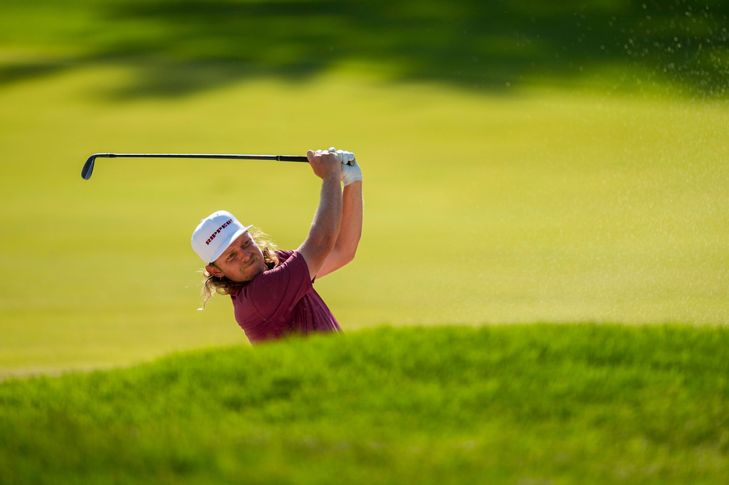 Cameron Smith, of Australia, hits from the 18th fairway during the final round of the PGA Championship golf tournament at Aronimink Golf Club, Sunday, May 17, 2026, in Newtown Square, PA. (AP Photo/Matt Slocum)