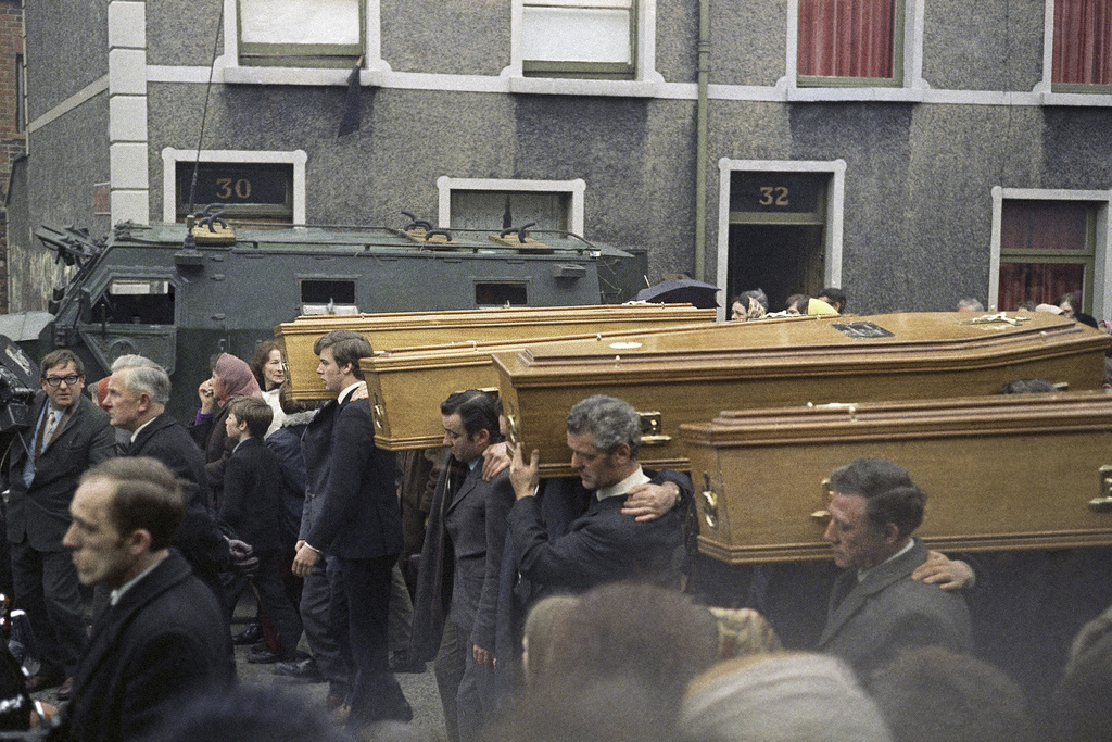 Coffins of people killed during the Bloody Sunday disturbances are carried during their funeral, in Belfast, in February 1972. (AP Photo/Michel Laurent, File)