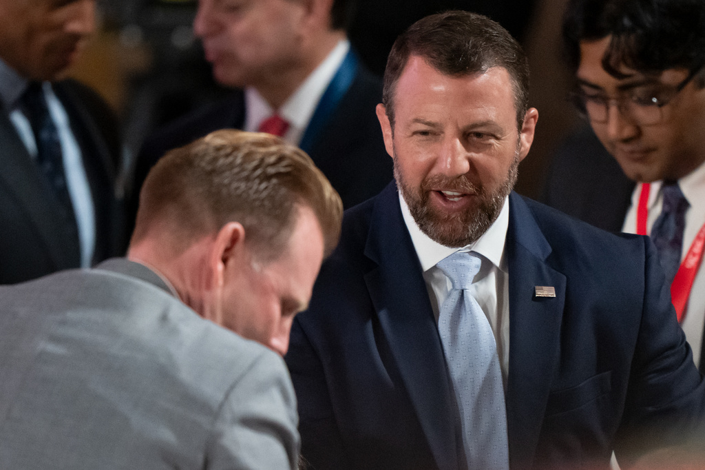 Homeland Security Secretary Markwayne Mullin, right, speaks with Andrew Giuliani before an event to mark the launch of the America.gov website, Tuesday, Sept. 29, 2026, in Washington. (AP Photo/Mark Schiefelbein)