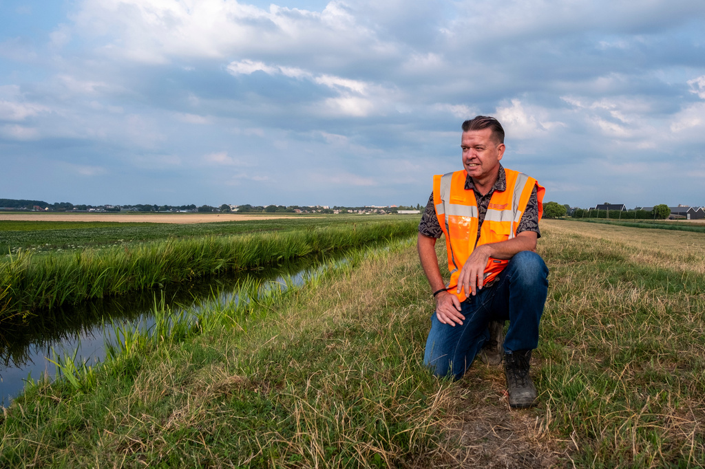 Peter van Duijvendijk, flood defense manager, poses near a dike in Waddinxveen, Netherlands, Thursday, July 30, 2026, during drought conditions. (AP Photo/Patrick Post)