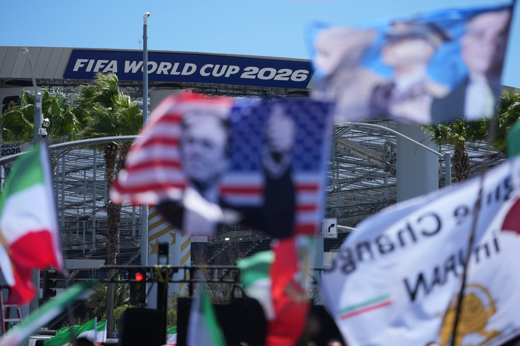 People protest outside Los Angeles Stadium before the World Cup Group G soccer match between Iran and New Zealand in Inglewood, Calif., near Los Angeles, Monday, June 15, 2026. (AP Photo/Jae C. Hong)