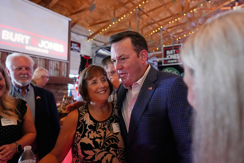 Georgia gubernatorial candidate Burt Jones meets with supporters during a primary election night watch party, Tuesday, May 19, 2026, in Jackson, Ga. (AP Photo/Mike Stewart)