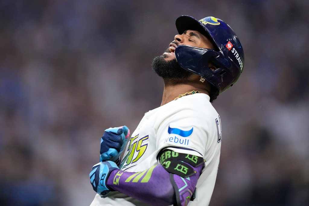 Tampa Bay Rays' Junior Caminero celebrates a two-run home run against the Cleveland Guardians during the seventh inning in Game 6 of an American League Championship Series baseball game in St. Petersburg, Fla. Monday, Oct. 19, 2026. (AP Photo/David J. Phillip)