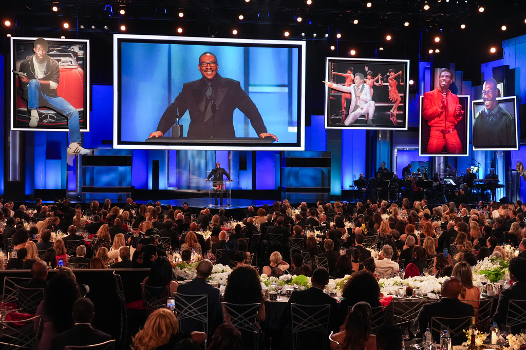 Eddie Murphy accepts the 51st AFI Life Achievement Award during a tribute to him on Saturday, April 18, 2026, at the Dolby Theatre in Los Angeles. (AP Photo/Chris Pizzello)