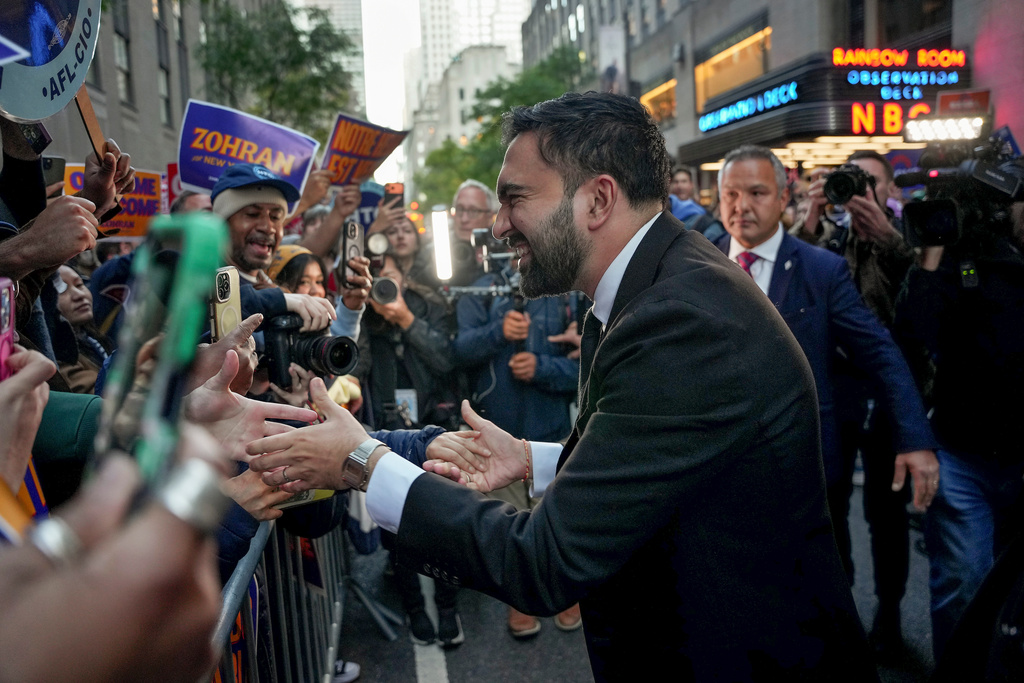 Democratic candidate Zohran Mamdani greets supporters upon arriving to participate in a mayoral debate, Thursday, Oct. 16, 2025, in New York. (AP Photo/Angelina Katsanis)