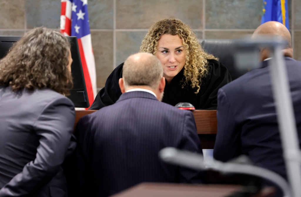 District Court Judge Carli Kierny confers with Michael Sanft, attorney for Duane Davis, left, and Chief Deputy District Attorneys Marc DiGiacomo, center, and Binu Palal, during the Duane Davis murder trial, related to the 1996 killing of rapper Tupac Shakur, at Clark County District Court Regional Justice Center in Las Vegas, Monday, Aug. 17, 2026. (Steve Marcus/Pool Photo via AP)