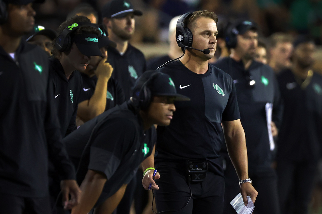 FILE - North Texas head coach Eric Morris watches the game against South Florida from the sideline in an NCAA college football game, Oct. 10, 2025, in Denton, Texas. (AP Photo/Richard W. Rodriguez, file)