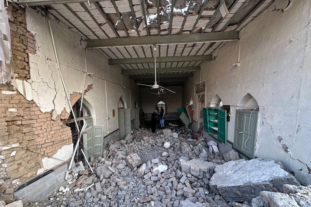 Army soldiers and members of media gather at the site of a powerful bomb exploded at a mosque in Kohat, in northwestern Pakistan, Friday, Sept. 18, 2026. (AP Photo/Maaz Awan)