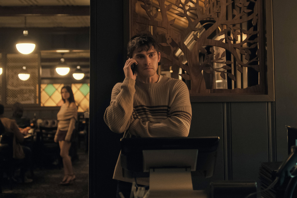 This image released by Focus Features shows Inde Navarrette, left, and Michael Johnston in a scene from "Obsession." (Focus Features via AP)