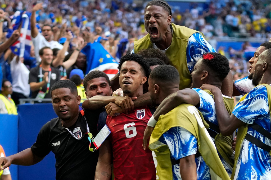 Cape Verde's Kevin Pina, center, celebrates with teammates after scoring the opening goal during the World Cup Group H soccer match between Uruguay and Cape Verde in Miami Gardens, Fla., Sunday, June 21, 2026. (AP Photo/Lynne Sladky)