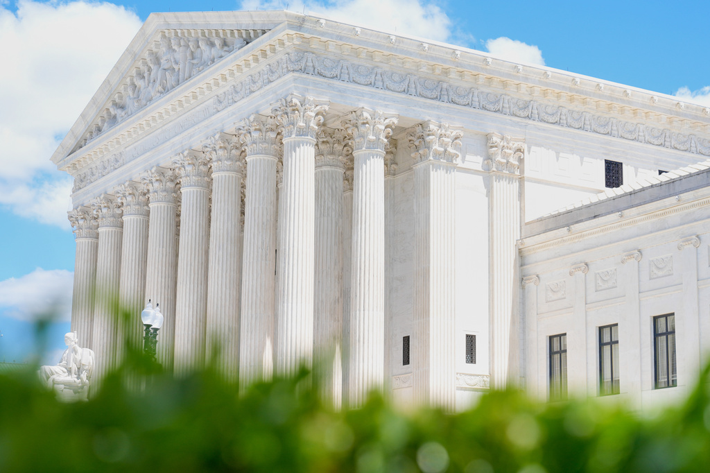 A statue titled the "Authority of Law" sits in front of the Supreme Court on Friday, May 15, 2026, in Washington. (AP Photo/Mariam Zuhaib)