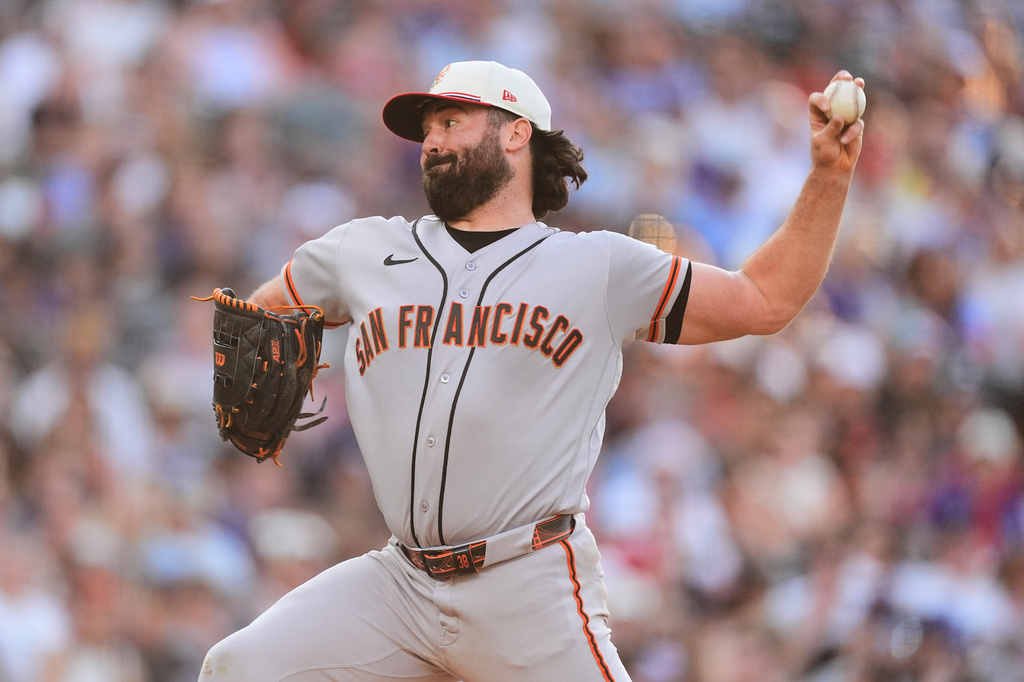 San Francisco Giants starting pitcher Robbie Ray works against the Colorado Rockies in the first inning of a baseball game Saturday, July 4, 2026, in Denver. (AP Photo/David Zalubowski)