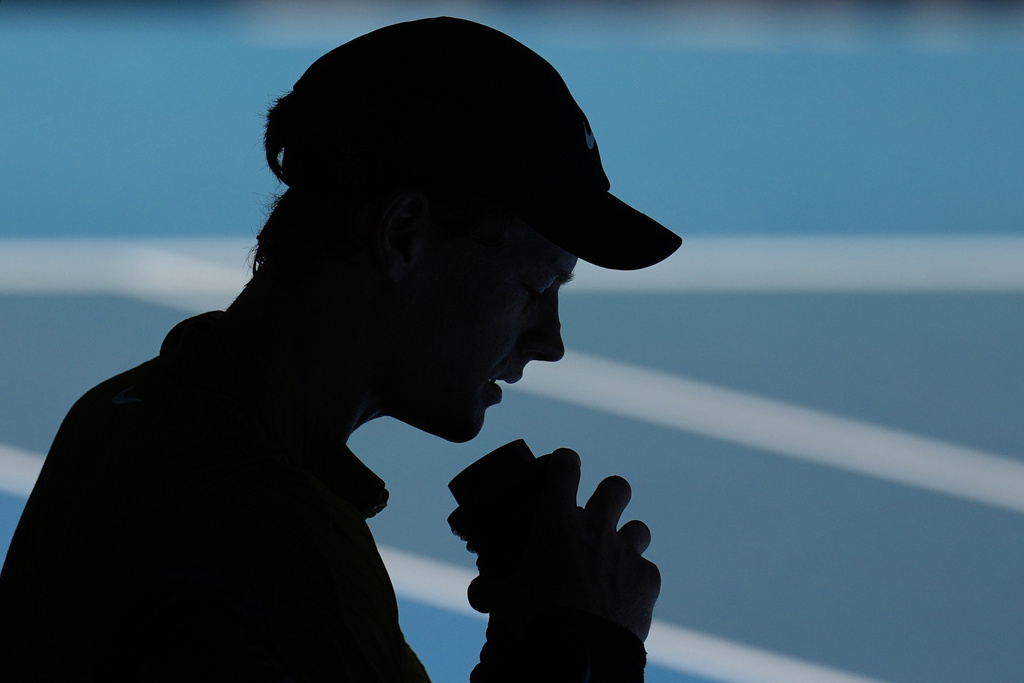 Jannik Sinner of Italy takes a drink during his third round match against Eliot Spizzirri of the U.S. at the Australian Open tennis championship in Melbourne, Australia, Saturday, Jan. 24, 2026. (AP Photo/Dita Alangkara)