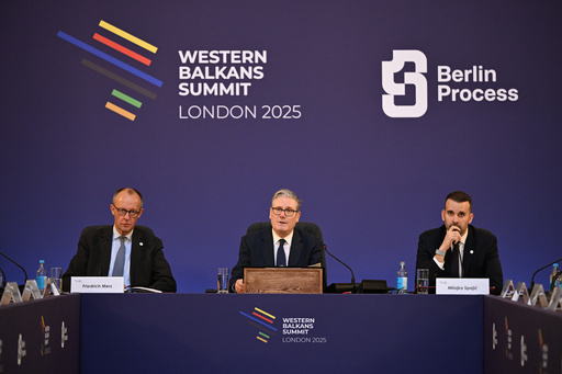 Britain's Prime Minister Keir Starmer, center, flanked by German Chancellor Friedrich Merz, left, and Montenegro's Prime Minister Milojko Spajic, hosts the plenary session of the Western Balkans Summit Western Balkans Summit in London, Wednesday, Oct. 22, 2025. (Chris J Ratcliffe/Pool Photo via AP) Britain's Prime Minister Keir Starmer, center, flanked by German Chancellor Friedrich Merz, left, and Montenegro's Prime Minister Milojko Spajic, hosts the plenary session of the Western Balkans Summit Western Balkans Summit in London, Wednesday, Oct. 22, 2025. (Chris J Ratcliffe/Pool Photo via AP)