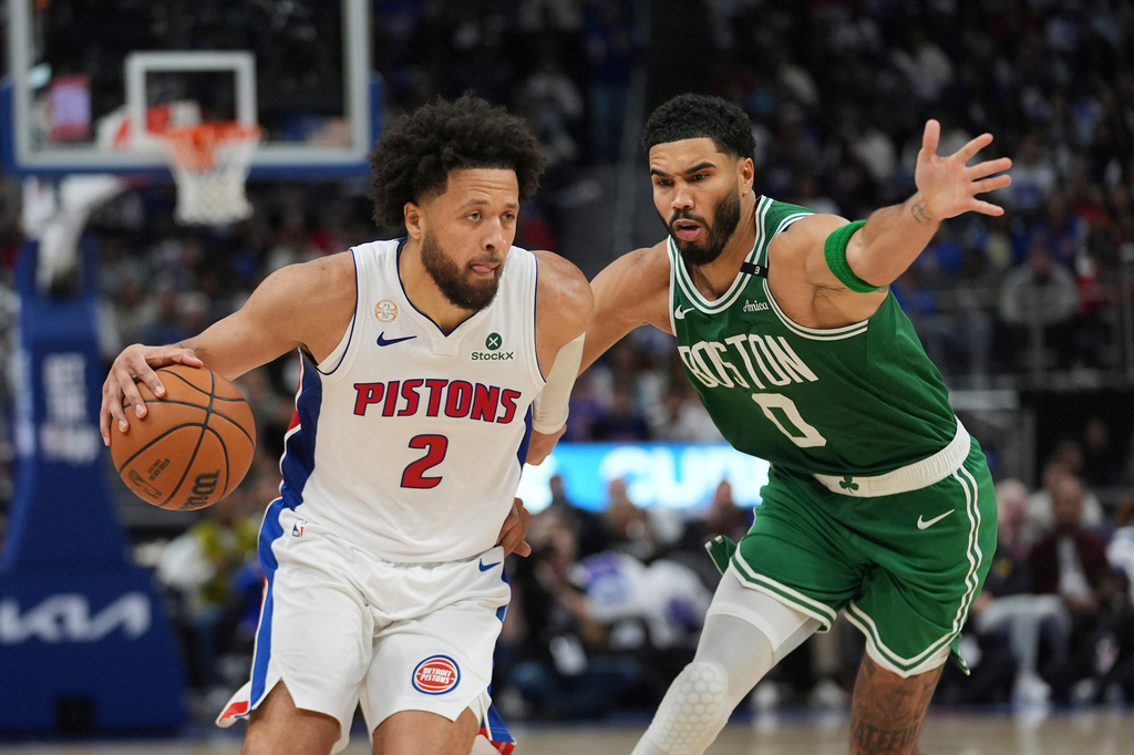 Detroit Pistons guard Cade Cunningham (2) drives on Boston Celtics forward Jayson Tatum (0) in the second half of an NBA basketball game in Detroit, Tuesday, Oct. 20, 2026. (AP Photo/Paul Sancya)