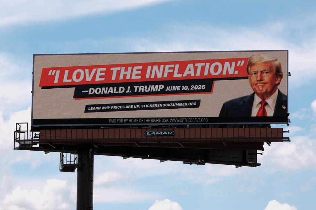 An electronic billboard with an image of President Donald Trump reads "I love the inflation." - Donald J. Trump June 10, 2026," is seen near I-74 in Cincinnati, Tuesday, June 16, 2026. (AP Photo/Carolyn Kaster)