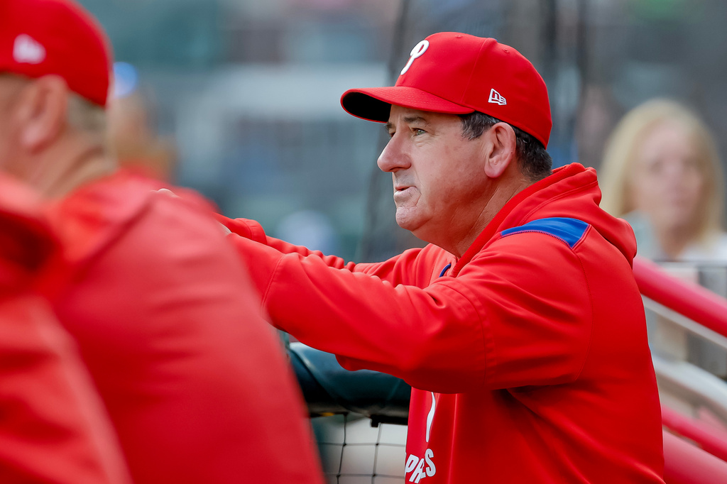 Philadelphia Phillies manager Rob Thomson in the dugout before playing the Atlanta Braves in a baseball game, Friday, April 24, 2026, in Atlanta. (AP Photo/Erik S. Lesser)