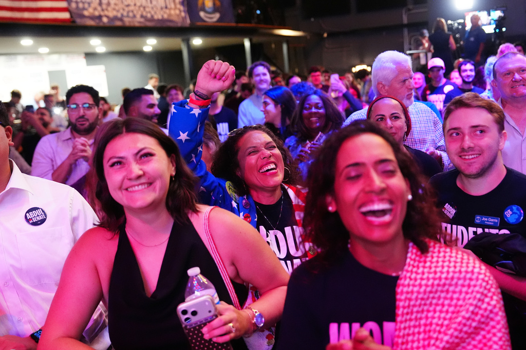 Attendees react to election results during a primary election night event for Abdul El-Sayed, a progressive candidate in the Democratic primary for U.S. Senate in Michigan, Wednesday, Aug. 5, 2026, at the Majestic Theatre in Detroit. (AP Photo/Julia Demaree Nikhinson)