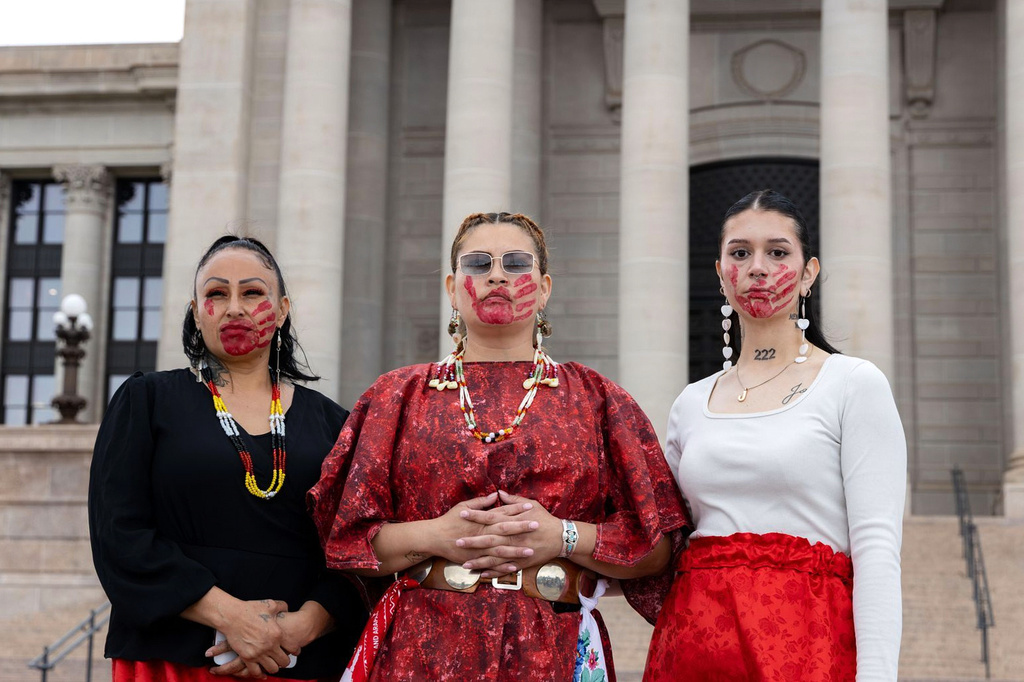 FILE - Theda Moreno, Cassandra Fraser and Tatum Escott attend an event to honor and raise awareness for Indigenous people who are missing or who have been killed, Tuesday, May 5, 2026, in Oklahoma City. (Sarah Liese/KOSU via AP,File)