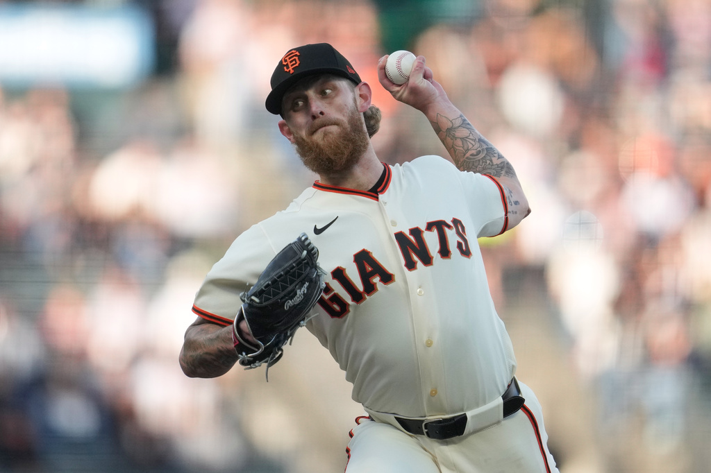 San Francisco Giants pitcher Carson Whisenhunt throws against the Colorado Rockies during the first inning of a baseball game Thursday, July 9, 2026, in San Francisco. (AP Photo/Jeff Chiu)