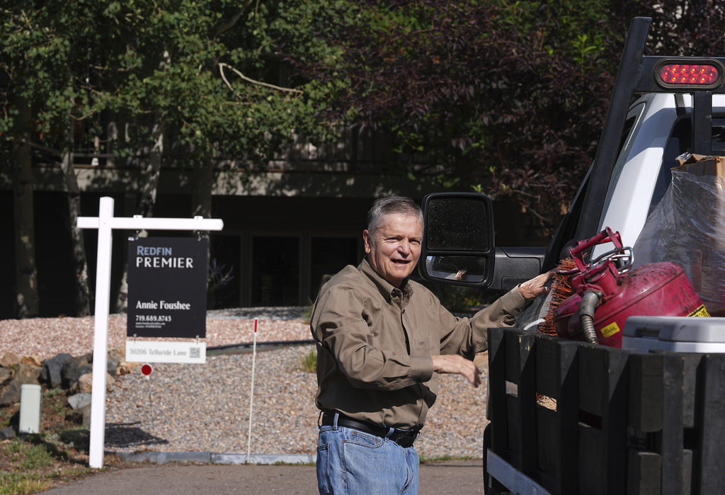 Doug McCormick is shown outside his four-bedroom home that has been up for sale for almost two months Tuesday, Aug. 26, 2025, near Evergreen, Colo. (AP Photo/David Zalubowski)