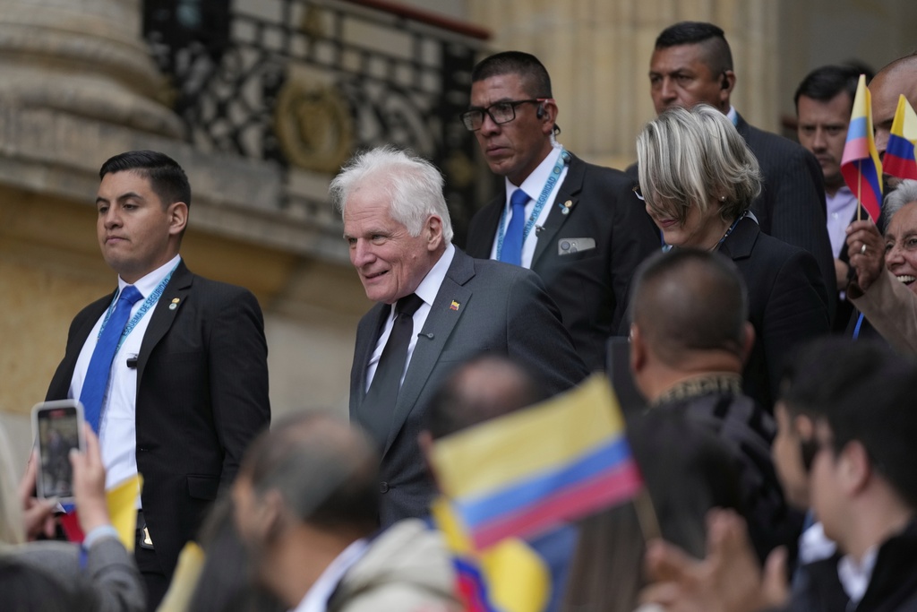 Miguel Uribe Londono, father of slain presidential candidate Miguel Uribe Turbay, arrives to read a statement to officially announce his bid for the presidency in Bogota, Colombia, Tuesday, Aug. 26, 2025. (AP Photo/Fernando Vergara)