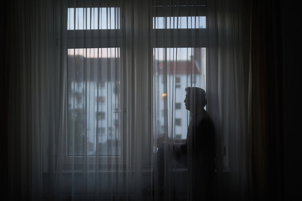 Former Xinjiang government engineer Nureli Abliz, who saw firsthand how surveillance technology flagged thousands of people in China for detention, even when they had committed no crime, sits for a portrait in Mannheim, Germany, Wednesday, July 23, 2025. (AP Photo/David Goldman)