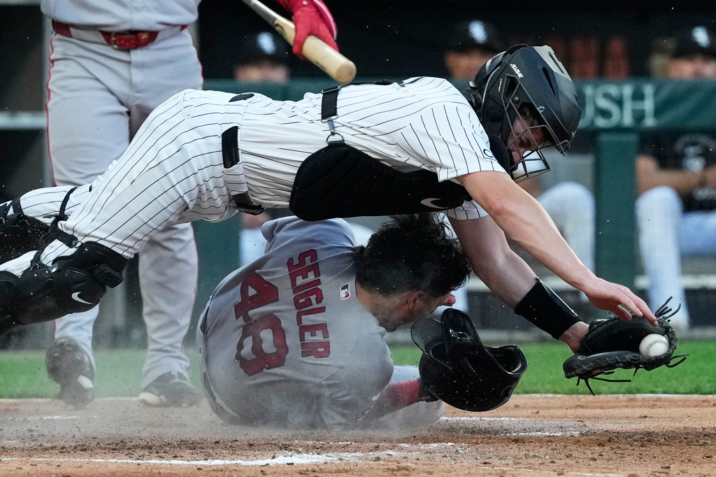 Boston Red Sox's Anthony Seigler (48) scores on a wild pitch by Chicago White Sox starting pitcher Davis Martin as catcher Kyle Teel catches the ball during the third inning of a baseball game in Chicago, Wednesday, July 8, 2026. (AP Photo/Nam Y. Huh)