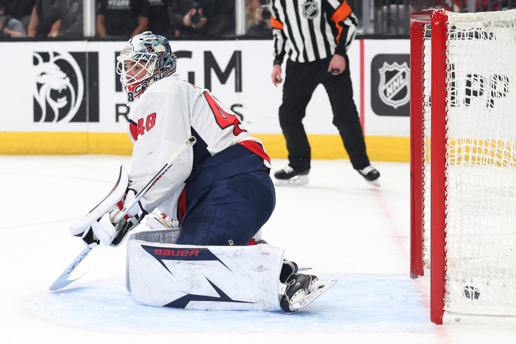 Washington Capitals goaltender Logan Thompson (48) fails to stop a shot against the Vegas Golden Knights during the second period of an NHL hockey game Saturday, March 28, 2026, in Las Vegas. (AP Photo/Ian Maule)