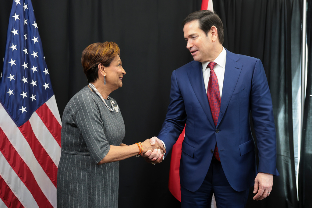 U.S. Secretary of State Marco Rubio, right, meets with Trinidad and Tobago Prime Minister Kamla Persad-Bissessar during the Caribbean Community (CARICOM) meeting in Basseterre, Saint Kitts and Nevis, Wednesday, Feb. 25, 2026. (Jonathan Ernst/Pool photo via AP)