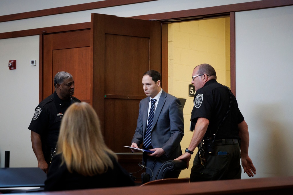 Brendan Banfield arrives to testify in his double murder trial in Fairfax County Circuit Court, Wednesday, Jan. 14, 2026, in Fairfax, Va. (AP Photo/Tom Brenner, Pool)
