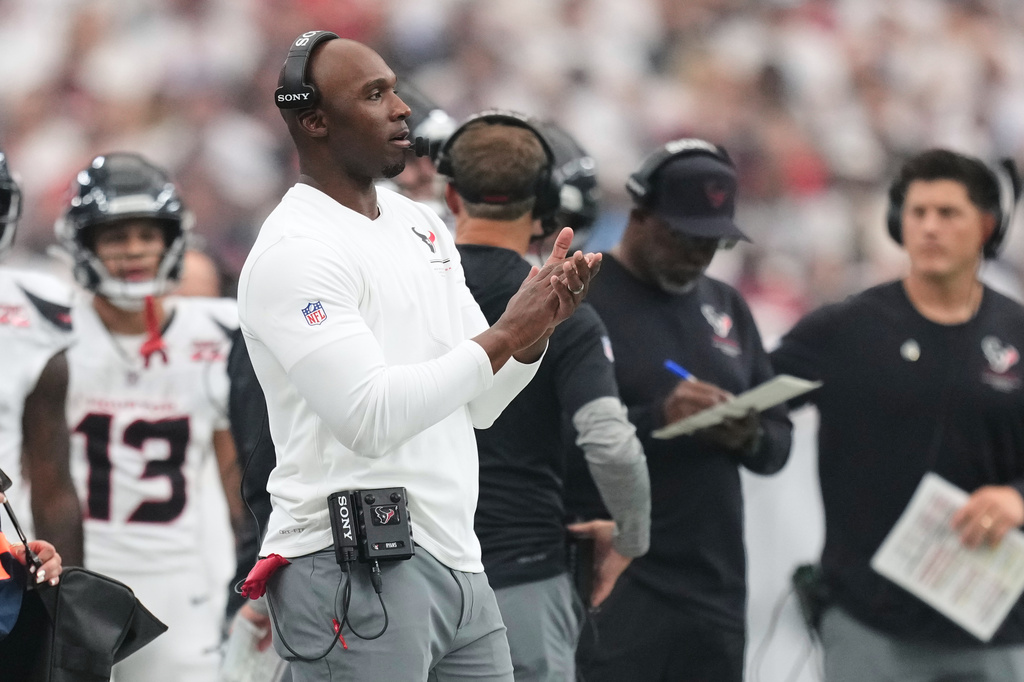 Houston Texans head coach DeMeco Ryans applauds from the sidelines during the first half of an NFL football game against the Buffalo Bills, Sunday, Sept. 13, 2026, in Houston. (AP Photo/Ashley Landis)