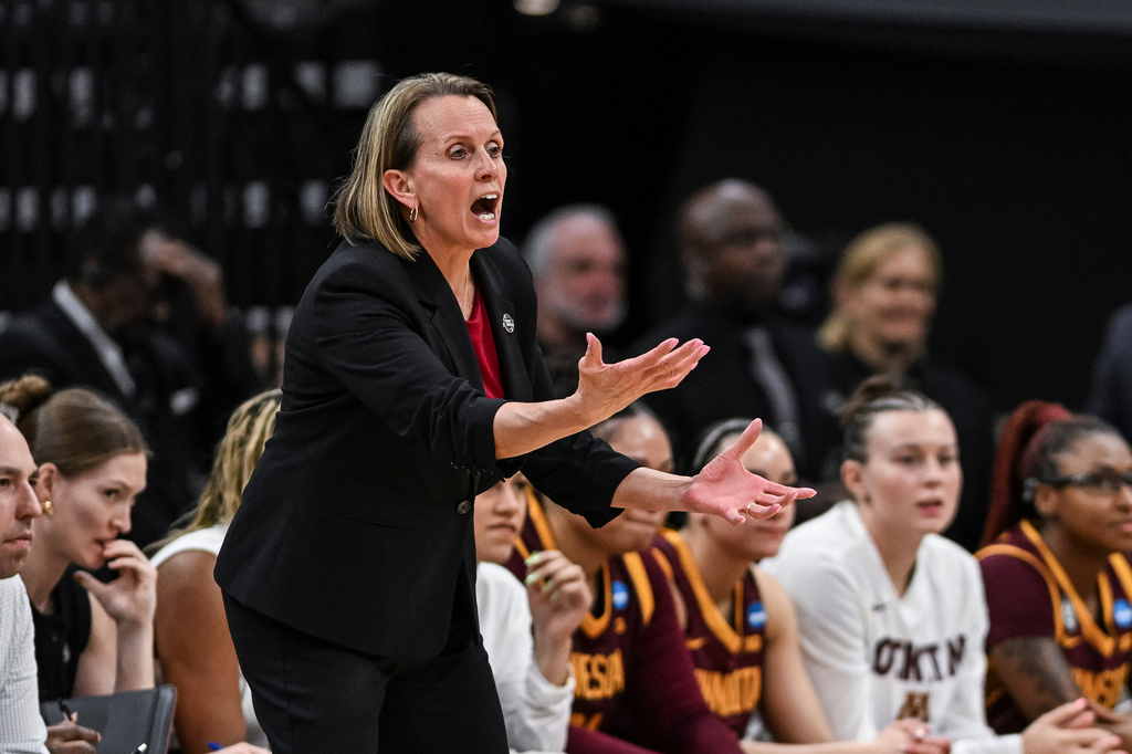 Minnesota head coach Dawn Plitzuweit reacts against UCLA during the first half in the Sweet 16 of the NCAA college basketball tournament Friday, March 27, 2026, in Sacramento, Calif. (AP Photo/Justine Willard)