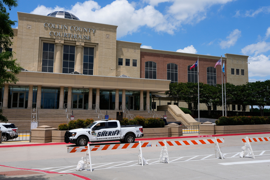 A Collin County sheriff drives past the front of the county courthouse Thursday, June 4, 2026, in McKinney, Texas. (AP Photo/Tony Gutierrez)