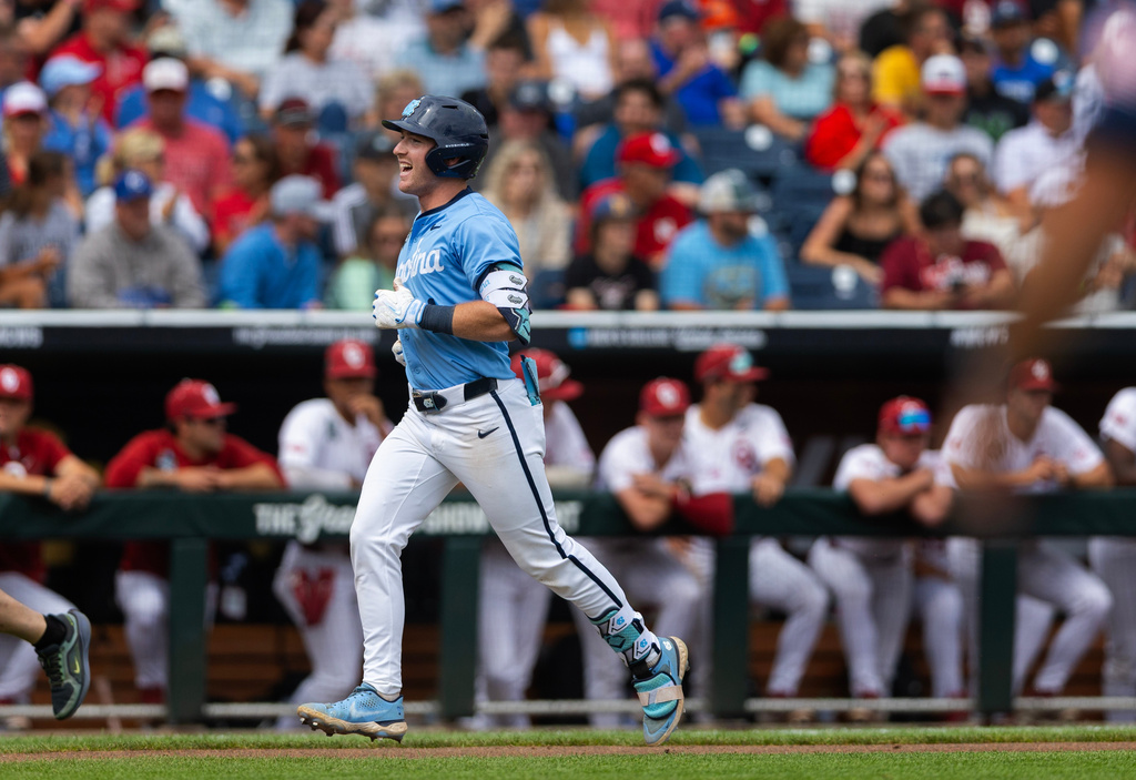 North Carolina's Cooper Nicholson celebrates after hitting a two-run home run against Oklahoma in the seventh inning of Game 2 of the NCAA College World Series baseball finals in Omaha, Neb., Sunday, June 21, 2026. (AP Photo/Rebecca S. Gratz)