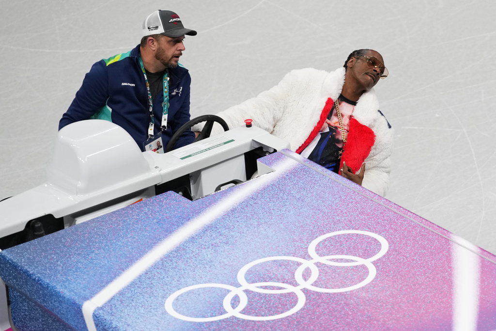 American artist Snoop Dogg stands on an ice resurfacer at the figure skating venue rink ahead of the 2026 Winter Olympics in Milan, Italy, on Tuesday, Feb. 3, 2026. (AP Photo/Christophe Ena)